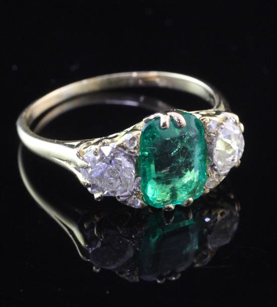 A Victorian style 18ct gold, three stone emerald and diamond ring, size T.